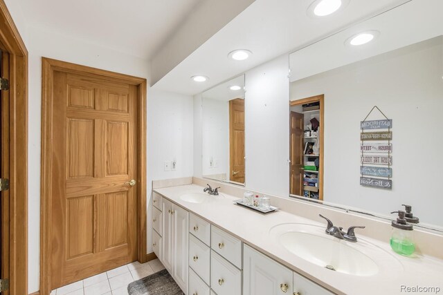 2475 S Ortonville Rd S, Ortonville, MI 48462 - full bathroom featuring double vanity, tile patterned floors, and recessed lighting