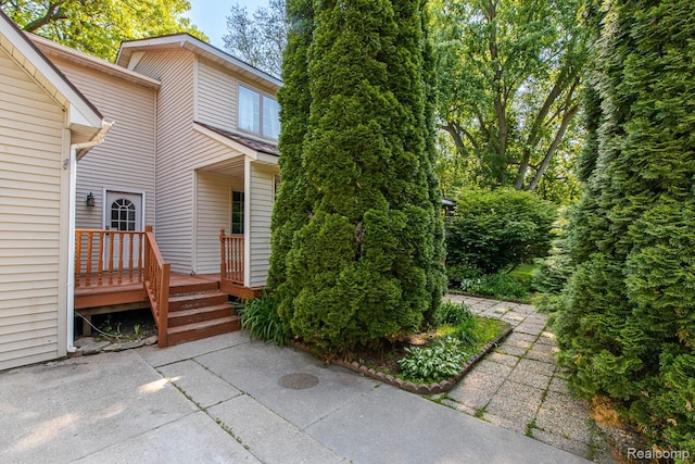 2475 S Ortonville Rd S, Ortonville, MI 48462 - entrance to property featuring a patio area and a wooden deck