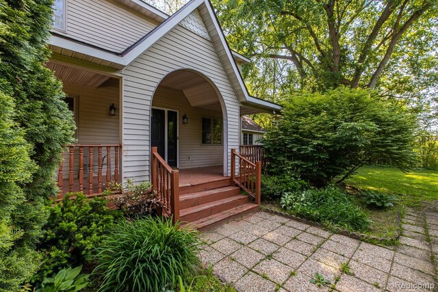 2475 S Ortonville Rd S, Ortonville, MI 48462 - view of exterior entry featuring covered porch
