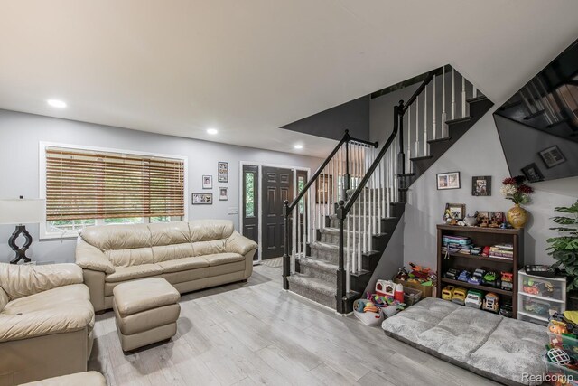 2475 S Ortonville Rd S, Ortonville, MI 48462 - living area featuring wood finished floors, stairs, recessed lighting, and healthy amount of natural light