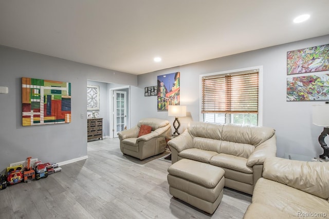 2475 S Ortonville Rd S, Ortonville, MI 48462 - living area with light wood-style flooring, healthy amount of natural light, recessed lighting, and baseboards