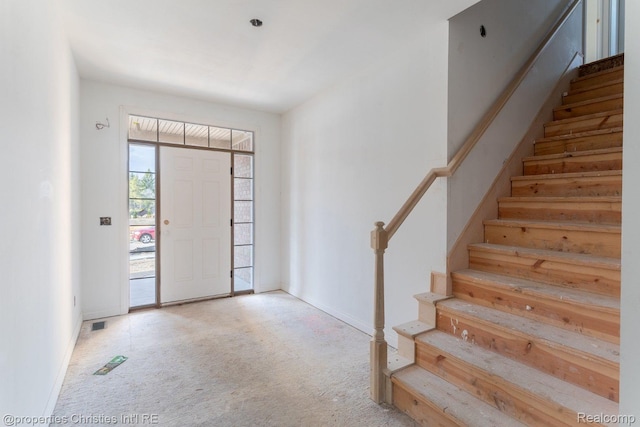 3201 Roma Ct, Wixom, MI 48393 - carpeted entryway with stairs and baseboards