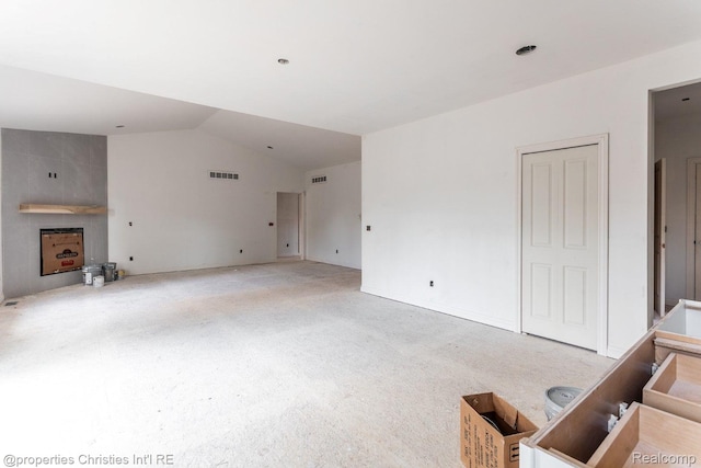 3201 Roma Ct, Wixom, MI 48393 - unfurnished living room with lofted ceiling and carpet