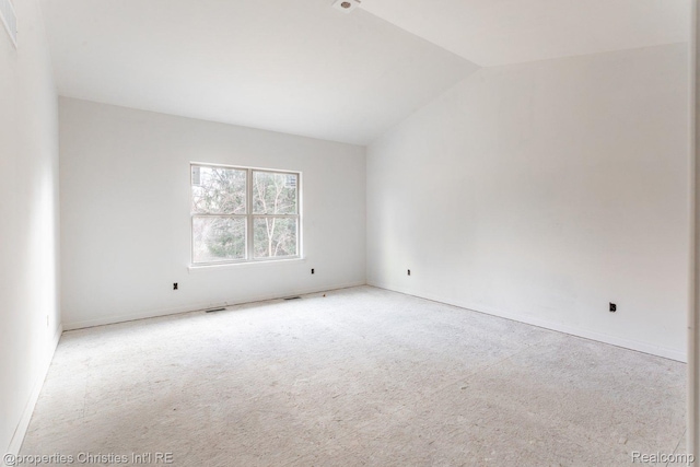 3201 Roma Ct, Wixom, MI 48393 - unfurnished room with carpet flooring, vaulted ceiling, and baseboards