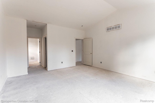 3201 Roma Ct, Wixom, MI 48393 - unfurnished room with vaulted ceiling and baseboards