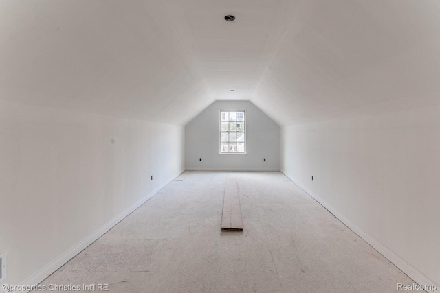 3201 Roma Ct, Wixom, MI 48393 - bonus room with lofted ceiling, carpet floors, and baseboards