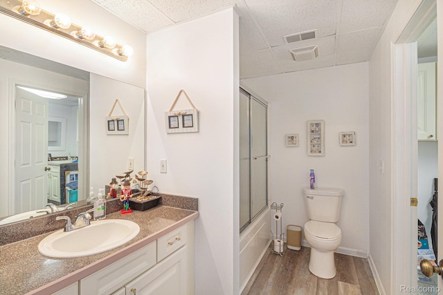 7374 Cross Creek Dr, Swartz Creek, MI 48473 - bathroom with a paneled ceiling, wood finished floors, vanity, toilet, and baseboards