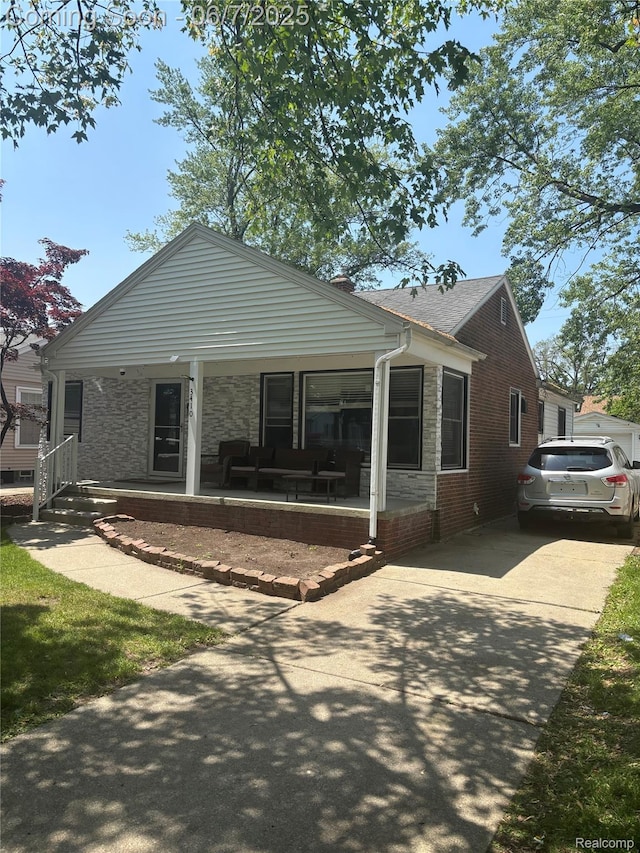 3410 Katherine St, Dearborn, MI 48124 - view of front of home featuring stone siding, concrete driveway, and brick siding