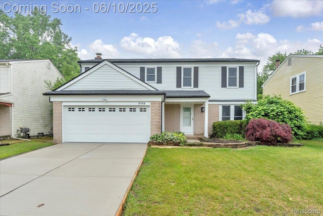 2148 E Roundtable Dr, Canton, MI 48188 - view of front of house featuring brick siding, driveway, a front yard, and a garage