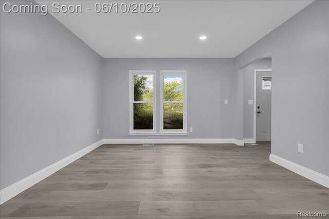 2148 E Roundtable Dr, Canton, MI 48188 - unfurnished room featuring baseboards, recessed lighting, and wood finished floors