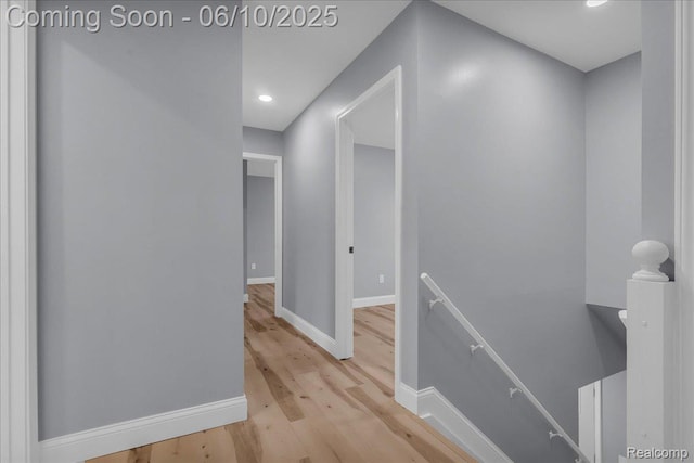 2148 E Roundtable Dr, Canton, MI 48188 - corridor with an upstairs landing, light wood-style floors, baseboards, and recessed lighting