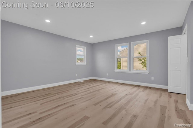 2148 E Roundtable Dr, Canton, MI 48188 - spare room with baseboards, wood finished floors, healthy amount of natural light, and recessed lighting