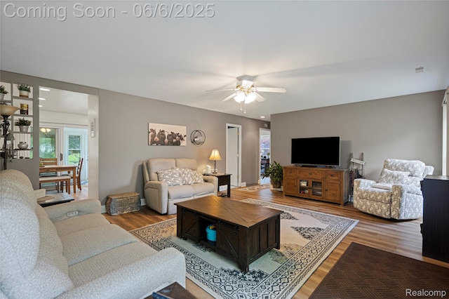 3886 Queensbury Rd, Lake Orion, MI 48359 - living area with ceiling fan and wood finished floors