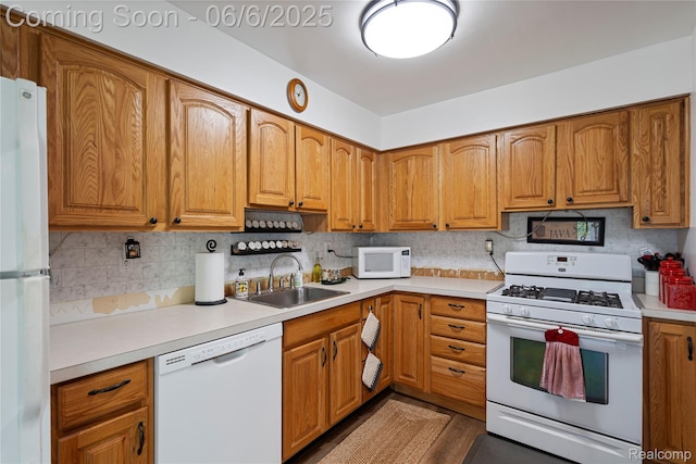 3886 Queensbury Rd, Lake Orion, MI 48359 - kitchen with white appliances, a sink, and light countertops
