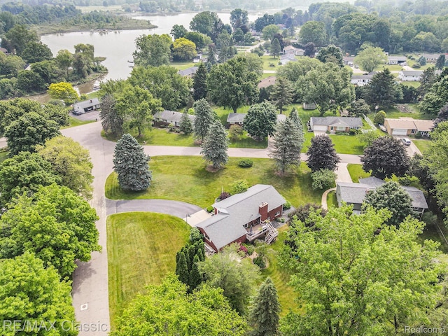 38 Meadowview Dr, Howell, MI 48843 - aerial view of residential area with a large body of water
