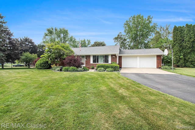38 Meadowview Dr, Howell, MI 48843 - ranch-style house with brick siding, an attached garage, driveway, and a front yard
