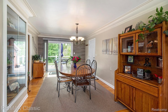 38 Meadowview Dr, Howell, MI 48843 - dining area with a chandelier, ornamental molding, light wood-type flooring, and baseboards