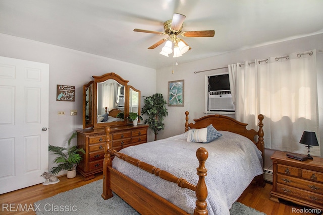 38 Meadowview Dr, Howell, MI 48843 - bedroom with wood finished floors, a ceiling fan, and cooling unit