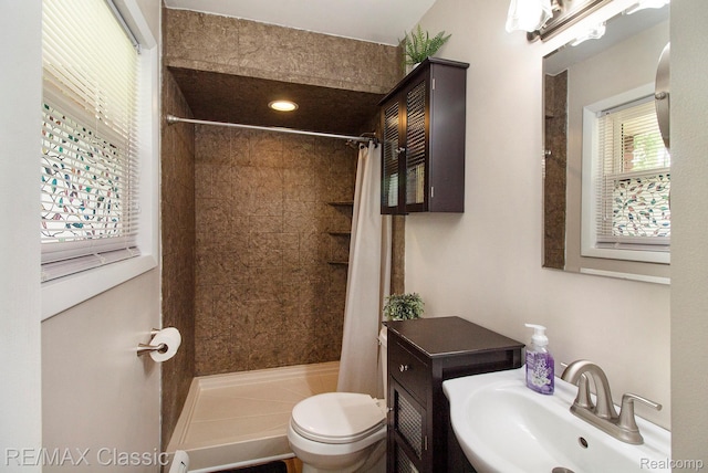 38 Meadowview Dr, Howell, MI 48843 - bathroom featuring a sink, toilet, and tiled shower