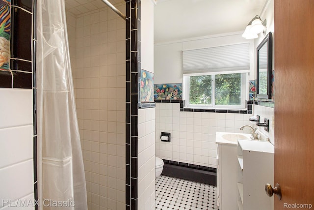 38 Meadowview Dr, Howell, MI 48843 - full bath with tile walls, vanity, toilet, tiled shower, and wainscoting