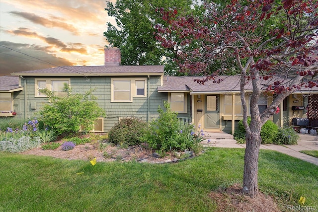 3417 Edgewood Dr, Ann Arbor, MI 48104 - split level home featuring a yard, a chimney, and roof with shingles