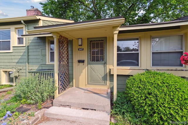 3417 Edgewood Dr, Ann Arbor, MI 48104 - doorway to property featuring a chimney
