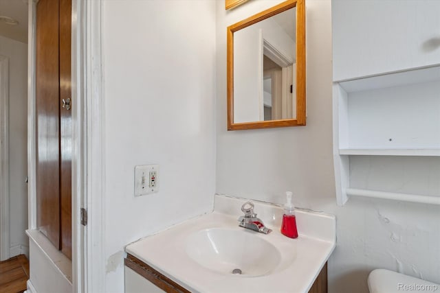 3417 Edgewood Dr, Ann Arbor, MI 48104 - half bathroom with vanity and toilet
