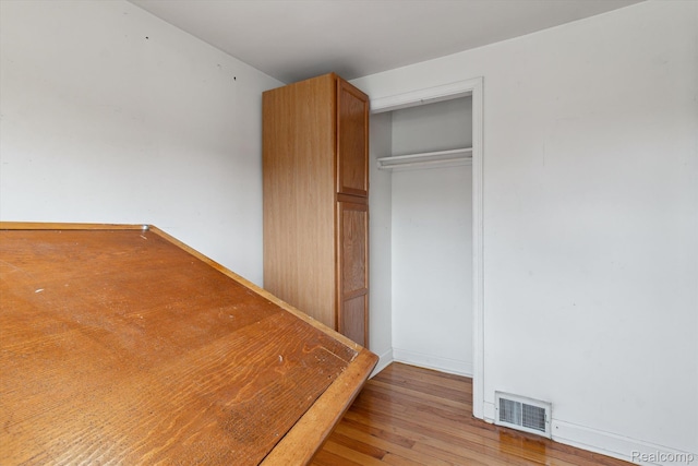 3417 Edgewood Dr, Ann Arbor, MI 48104 - unfurnished bedroom with light wood-style flooring and a closet