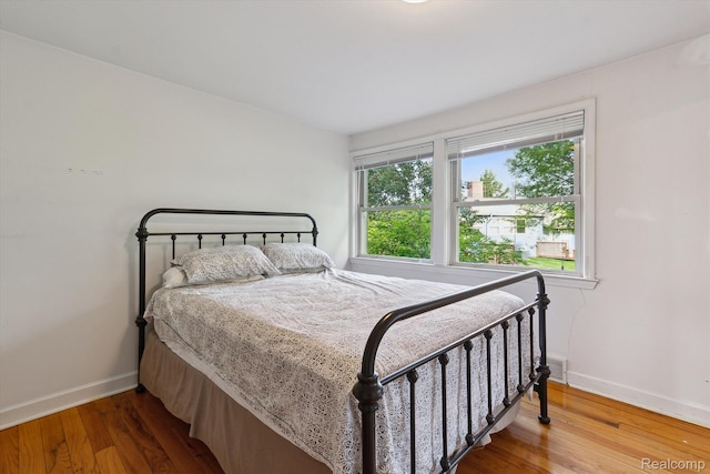 3417 Edgewood Dr, Ann Arbor, MI 48104 - bedroom with baseboards and wood finished floors
