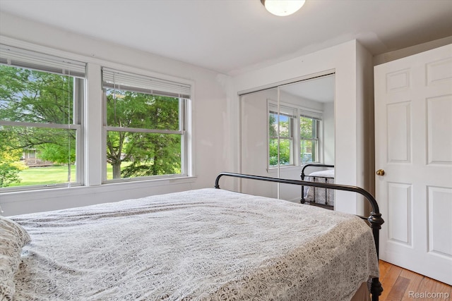 3417 Edgewood Dr, Ann Arbor, MI 48104 - bedroom featuring multiple windows and light wood finished floors