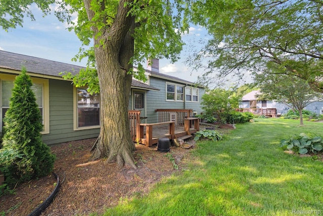 3417 Edgewood Dr, Ann Arbor, MI 48104 - rear view of house with a lawn, a deck, a chimney, and a shingled roof