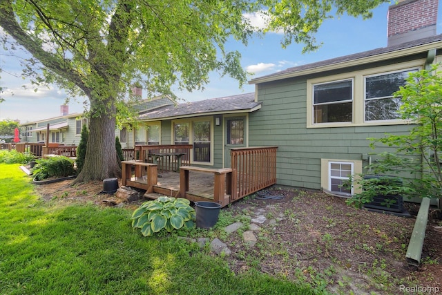 3417 Edgewood Dr, Ann Arbor, MI 48104 - rear view of property featuring a deck, a chimney, and roof with shingles