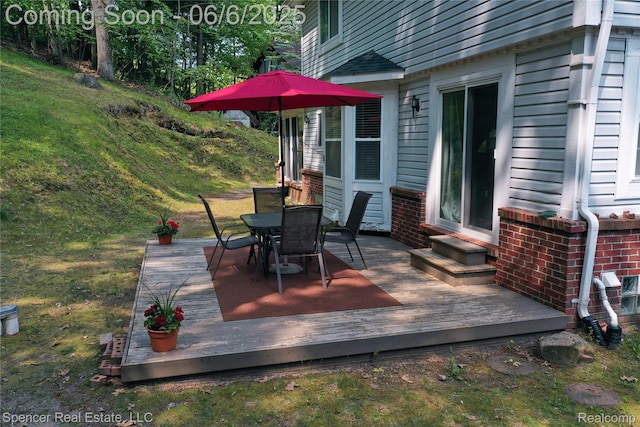 5005 Mohawk Ave, Clarkston, MI 48348 - wooden deck with outdoor dining area and entry steps