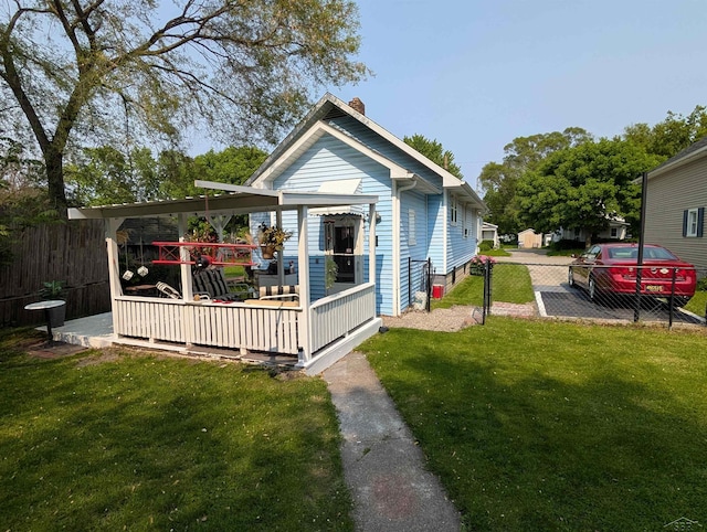 307 Aplin St, Bay City, MI 48706 - back of property featuring a chimney and a wooden deck