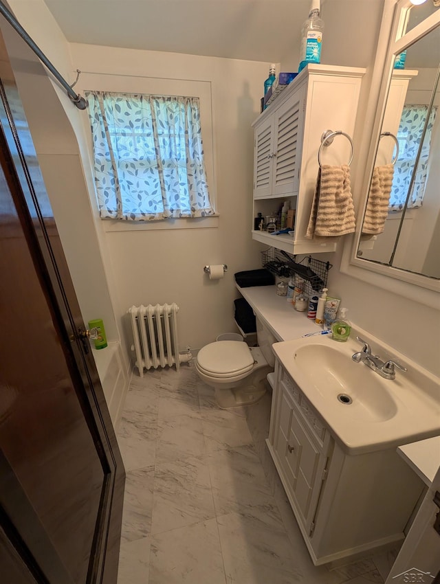 307 Aplin St, Bay City, MI 48706 - full bath featuring radiator, marble finish floors, vanity, toilet, and a shower