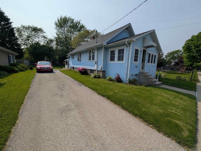307 Aplin St, Bay City, MI 48706 - view of front of property with asphalt driveway and entry steps