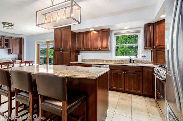 2400 Rolandale, West Bloomfield, MI 48324 - kitchen with a sink, a breakfast bar area, stainless steel appliances, a kitchen island, and healthy amount of natural light