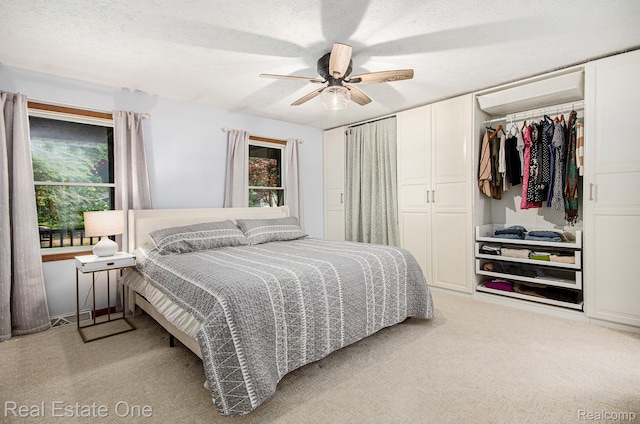 2400 Rolandale, West Bloomfield, MI 48324 - bedroom featuring light carpet, a closet, and a ceiling fan