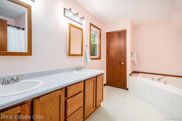 2400 Rolandale, West Bloomfield, MI 48324 - bathroom featuring double vanity, a garden tub, and a textured ceiling