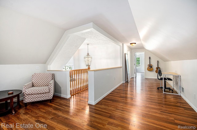 2400 Rolandale, West Bloomfield, MI 48324 - bonus room with wood finished floors, vaulted ceiling, baseboards, and a chandelier