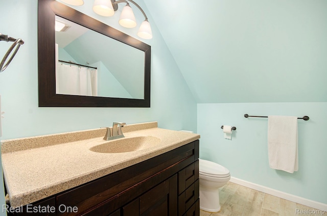 2400 Rolandale, West Bloomfield, MI 48324 - bathroom featuring vanity, toilet, vaulted ceiling, wood finished floors, and baseboards