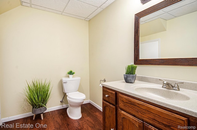 2400 Rolandale, West Bloomfield, MI 48324 - bathroom with vanity, toilet, wood finished floors, baseboards, and a drop ceiling