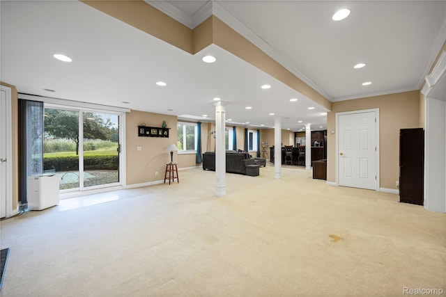 2401 Spyglass Dr, Oakland, MI 48363 - unfurnished living room featuring decorative columns, ornamental molding, light colored carpet, recessed lighting, and plenty of natural light
