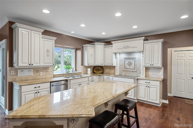 2401 Spyglass Dr, Oakland, MI 48363 - kitchen with stainless steel dishwasher, a breakfast bar area, recessed lighting, white cabinetry, and tasteful backsplash
