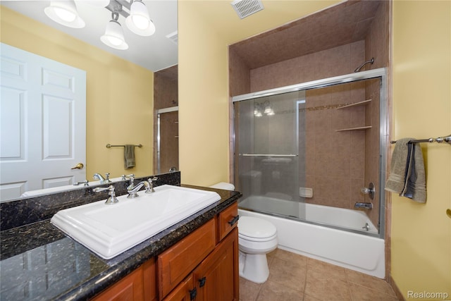 2401 Spyglass Dr, Oakland, MI 48363 - bathroom featuring vanity, tile patterned flooring, and shower / bath combination with glass door