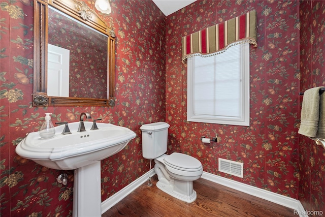 2401 Spyglass Dr, Oakland, MI 48363 - half bath featuring wood finished floors and baseboards
