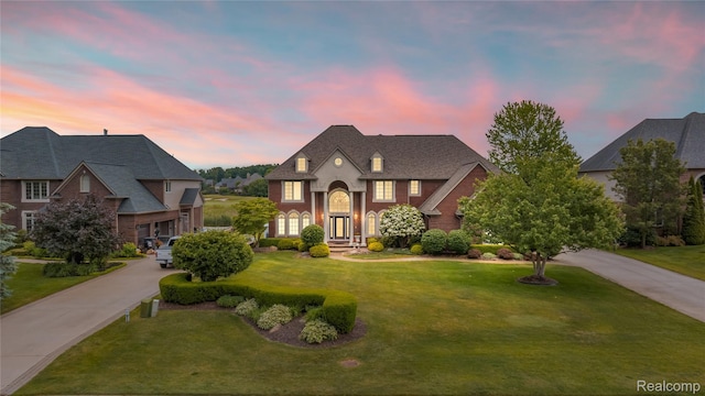 2401 Spyglass Dr, Oakland, MI 48363 - french provincial home with a yard and brick siding