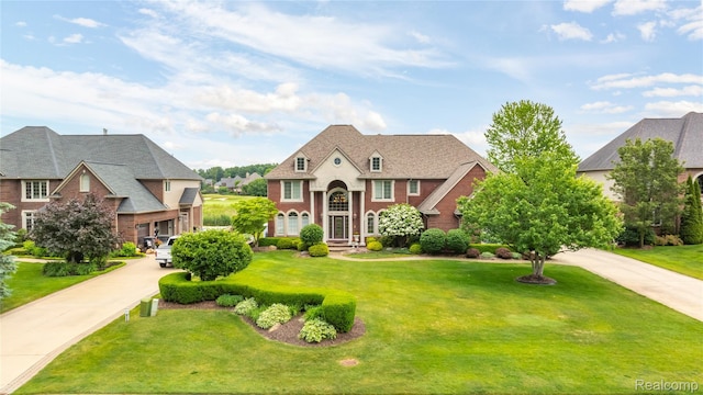 2401 Spyglass Dr, Oakland, MI 48363 - view of front facade featuring a front yard and brick siding