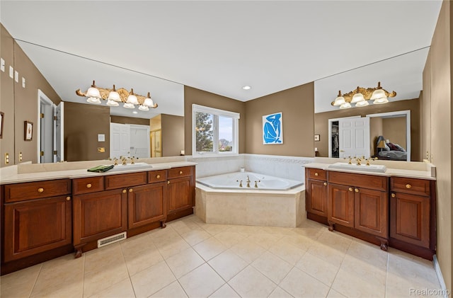 2401 Spyglass Dr, Oakland, MI 48363 - bathroom featuring two vanities, tile patterned floors, and a garden tub