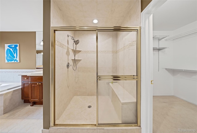 2401 Spyglass Dr, Oakland, MI 48363 - full bathroom with a stall shower, a garden tub, vanity, and a walk in closet